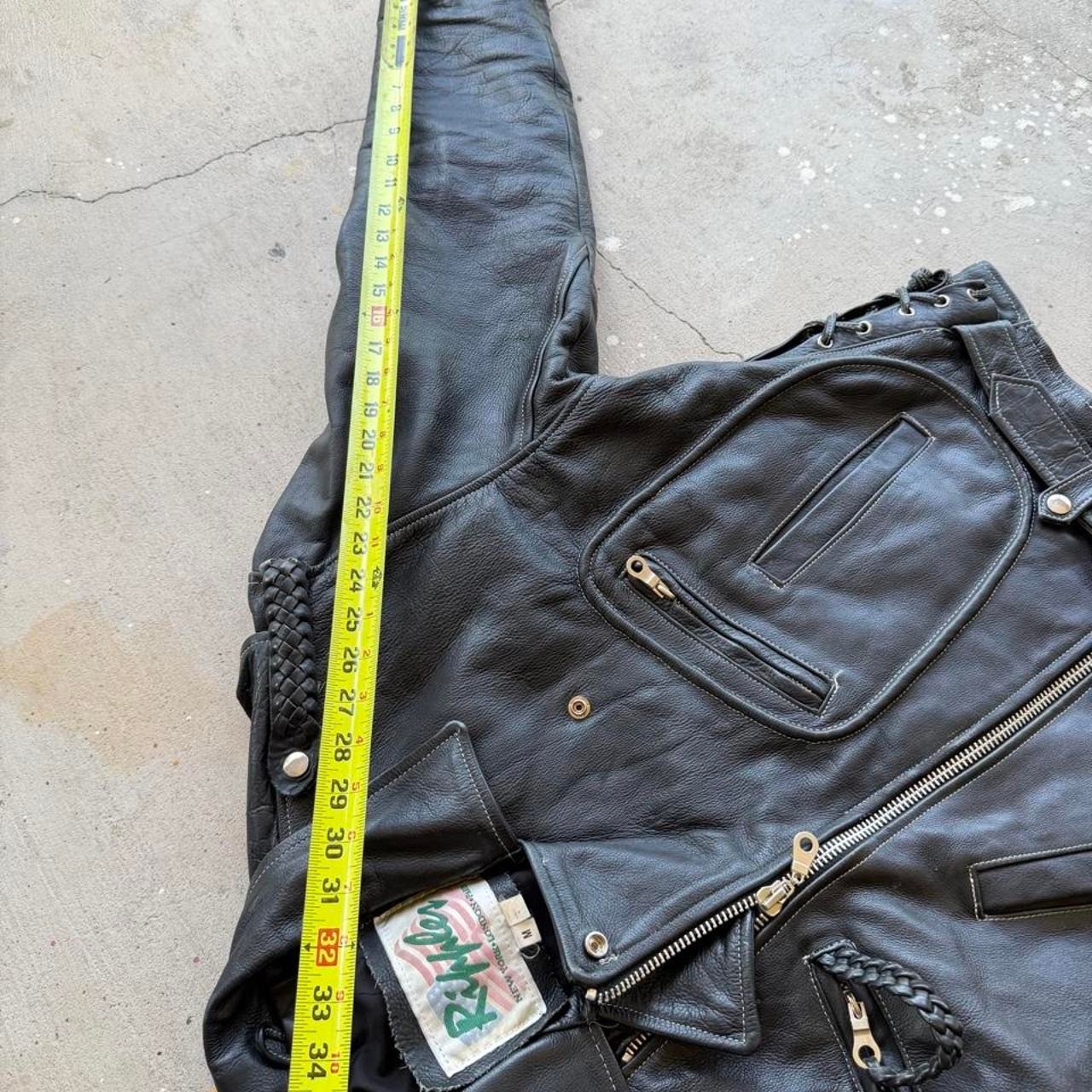 Black leather biker jacket with belt and zipper details Size M