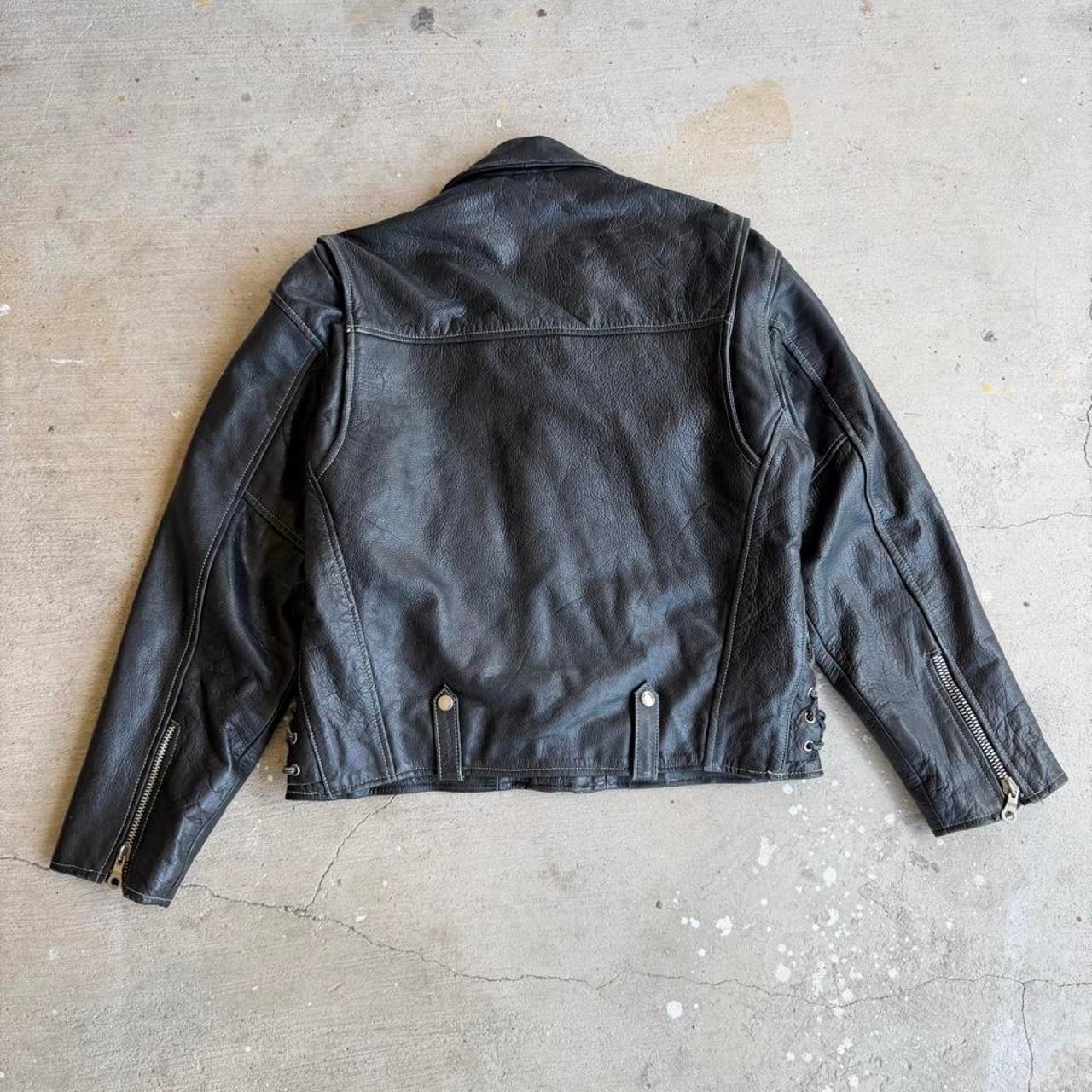 Black leather biker jacket with belt and zipper details Size M